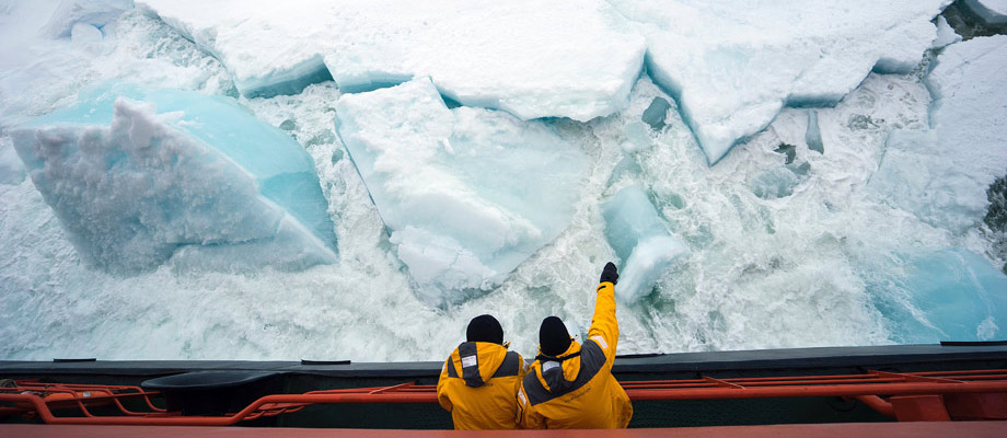 photo: crew pointing across the ice