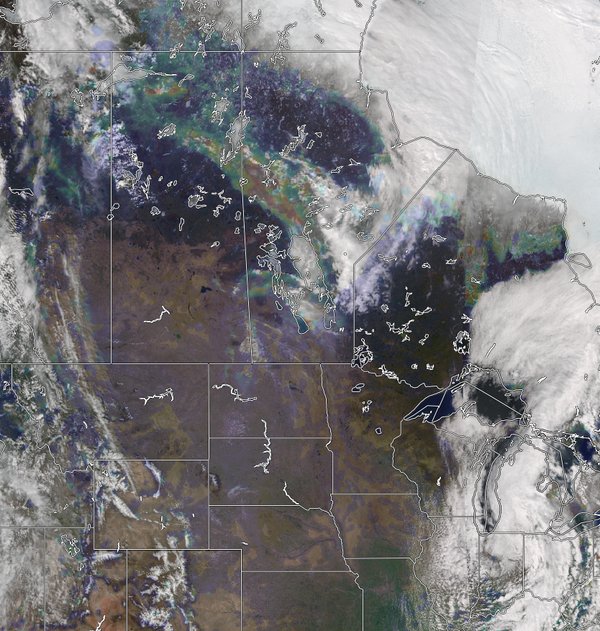 An overlay of the VIIRS True Color and the VIIRS Aersol Optical Depth (rainbow), which shows the smoke plume early in the life of the Fort McMurray fire.  (Courtesy Russell Dengel and RealEarth, SSEC, University of Wisconsin-Madison)