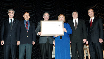 photo of Fred Wu and Eileen Maturi receiving DOC Silver Medal